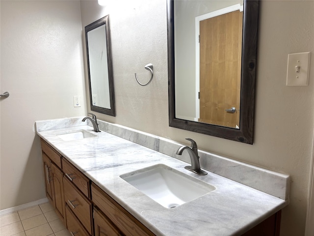bathroom with a sink, tile patterned floors, and double vanity