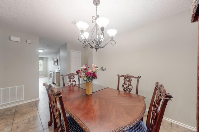 3073 Dusty Ridge Dr, Rockwall, TX 75032 - dining space featuring visible vents, baseboards, and a chandelier