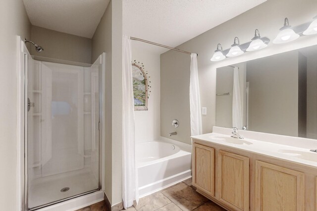 3073 Dusty Ridge Dr, Rockwall, TX 75032 - full bath featuring double vanity, a washtub, a shower, a sink, and tile patterned floors