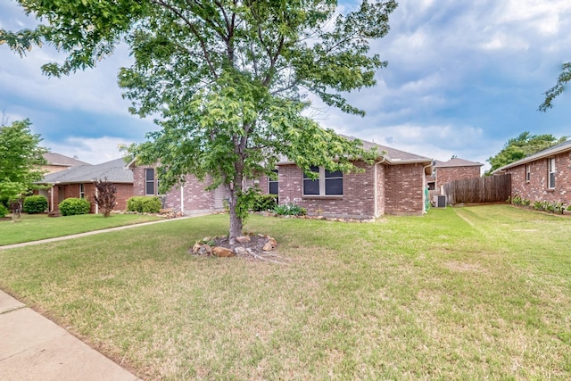 3073 Dusty Ridge Dr, Rockwall, TX 75032 - view of front of property featuring fence, brick siding, and a front yard