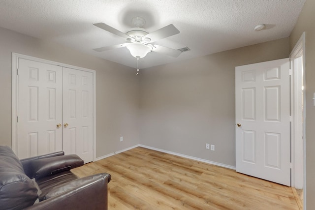 3073 Dusty Ridge Dr, Rockwall, TX 75032 - living area with a ceiling fan, baseboards, visible vents, and light wood-type flooring