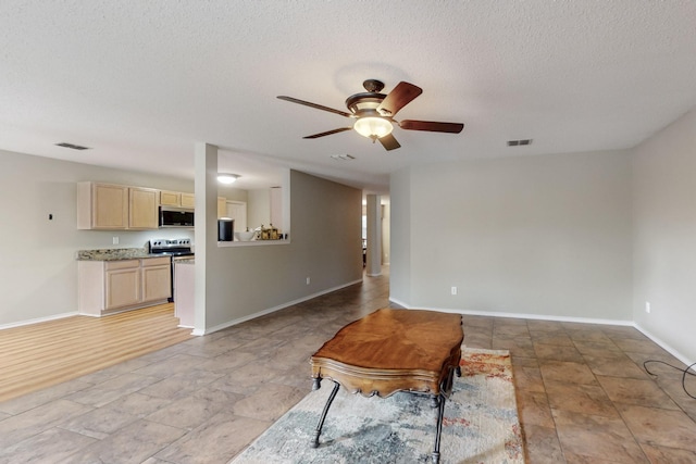 3073 Dusty Ridge Dr, Rockwall, TX 75032 - interior space featuring baseboards, ceiling fan, a textured ceiling, and visible vents