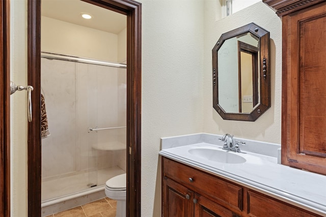 200 Bushwhacker Dr, Mabank, TX 75156 - bathroom with vanity, a textured wall, a stall shower, and toilet