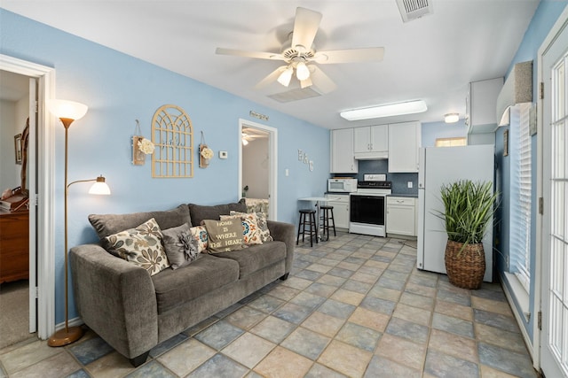 200 Bushwhacker Dr, Mabank, TX 75156 - living area with a ceiling fan, stone finish flooring, and visible vents