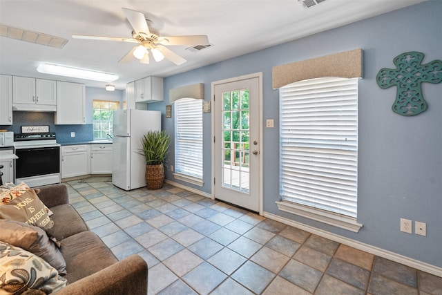 200 Bushwhacker Dr, Mabank, TX 75156 - living room featuring baseboards, a ceiling fan, and visible vents