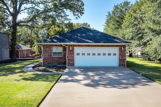 200 Bushwhacker Dr, Mabank, TX 75156 - single story home featuring brick siding, a garage, a front lawn, and driveway