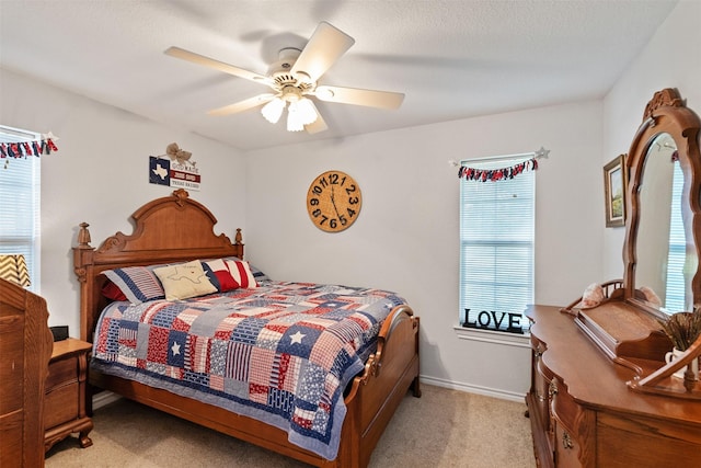 200 Bushwhacker Dr, Mabank, TX 75156 - bedroom with multiple windows, light carpet, and ceiling fan