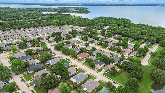 birds eye view of property with a residential view and a water view