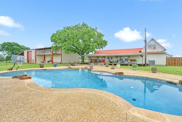 view of pool with a lawn, fence, and a fenced in pool