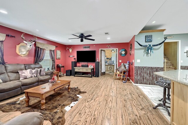 living area featuring light wood-style floors, ceiling fan, recessed lighting, and visible vents