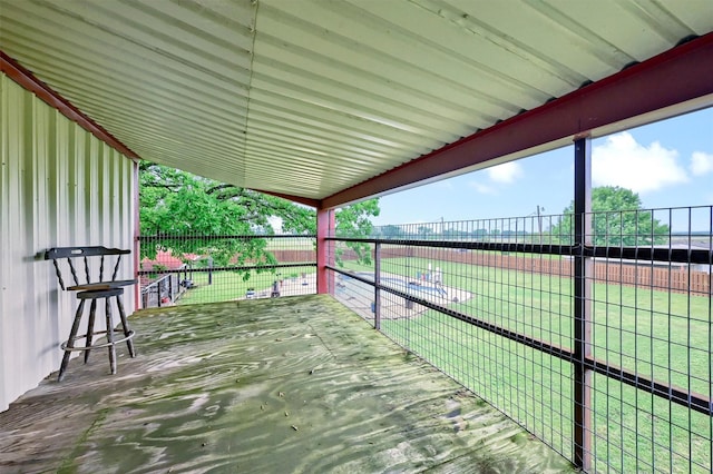 wooden terrace featuring fence