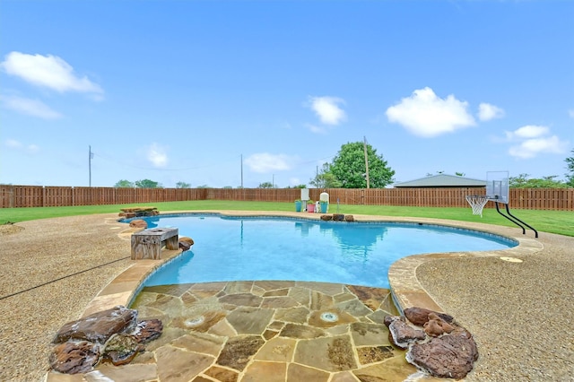 view of pool with a lawn, a patio, a fenced in pool, and a fenced backyard