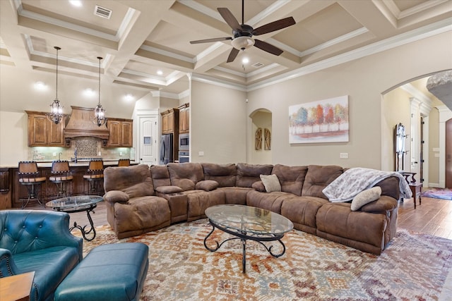 1408 Joshua Way, Granbury, TX 76048 - living area featuring arched walkways, ceiling fan, visible vents, and coffered ceiling
