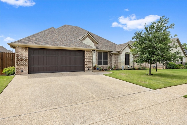 1408 Joshua Way, Granbury, TX 76048 - ranch-style home featuring a front lawn, brick siding, a shingled roof, concrete driveway, and an attached garage