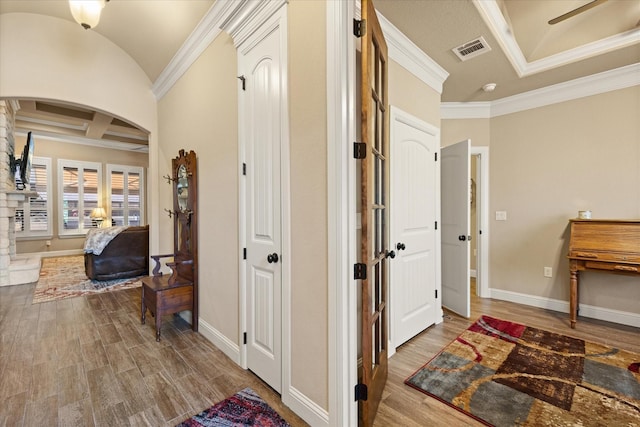 1408 Joshua Way, Granbury, TX 76048 - corridor featuring visible vents, crown molding, arched walkways, wood finished floors, and baseboards