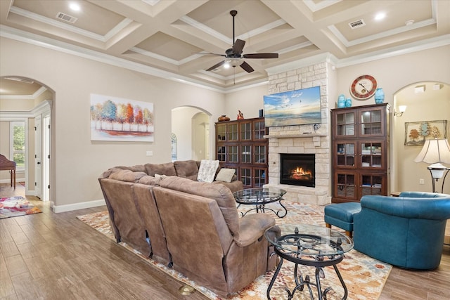 1408 Joshua Way, Granbury, TX 76048 - living area with crown molding, ceiling fan, arched walkways, wood finished floors, and visible vents