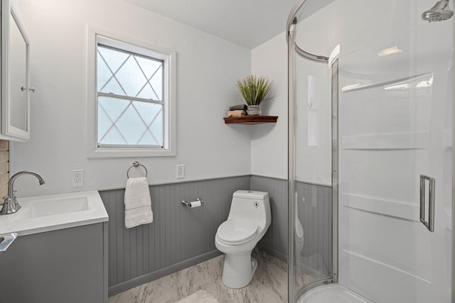 356 Bedford Ct E, Bedford, TX 76022 - full bath with wainscoting, vanity, toilet, marble finish floor, and a stall shower