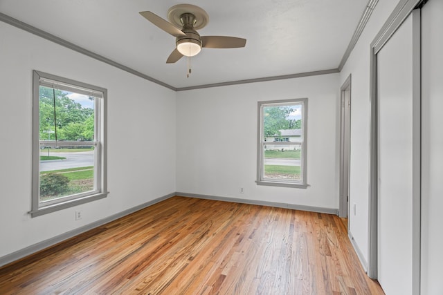 356 Bedford Ct E, Bedford, TX 76022 - empty room with crown molding, baseboards, ceiling fan, and light wood-style flooring