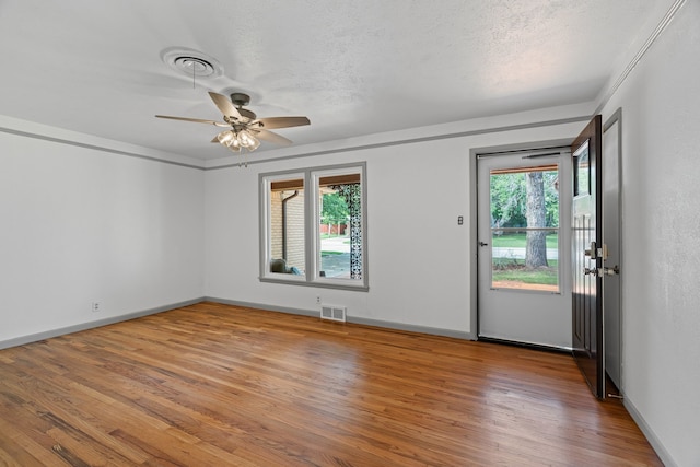 356 Bedford Ct E, Bedford, TX 76022 - empty room with visible vents, a ceiling fan, baseboards, and wood finished floors