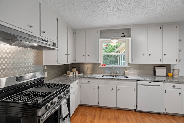 356 Bedford Ct E, Bedford, TX 76022 - kitchen with a sink, stainless steel gas range oven, under cabinet range hood, dishwasher, and tasteful backsplash