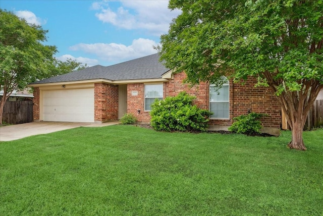 ranch-style home with driveway, brick siding, fence, a front lawn, and an attached garage