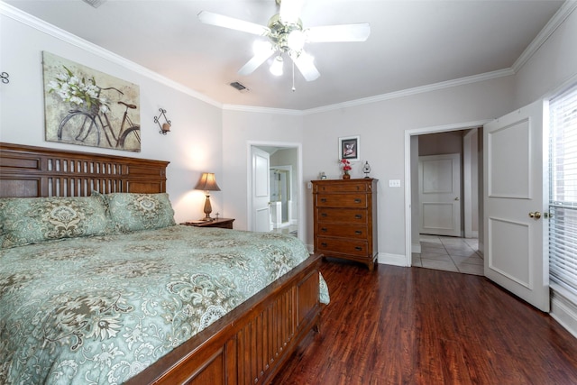 bedroom featuring crown molding, dark wood-style flooring, a ceiling fan, baseboards, and visible vents