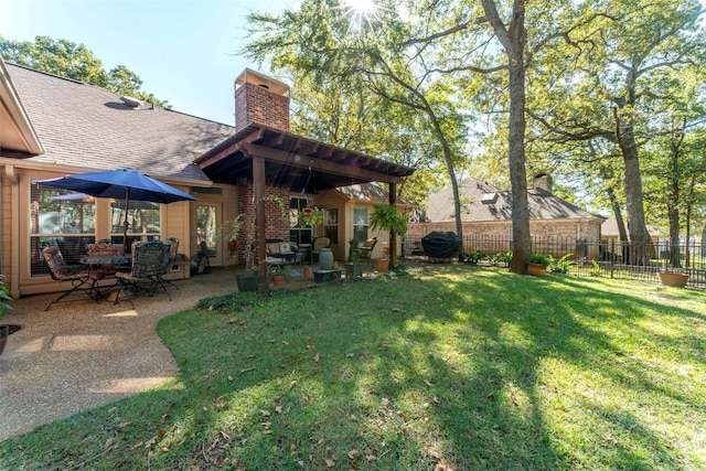 view of yard with fence and a patio area