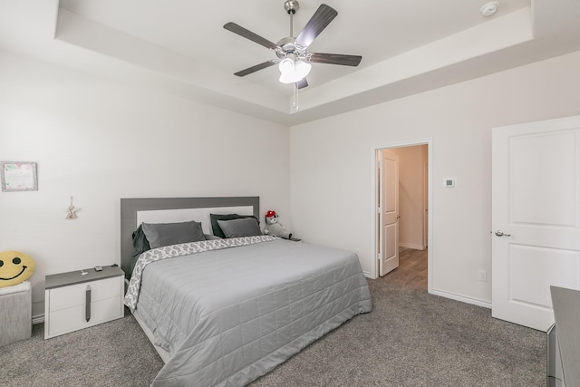 2825 Jasper Trl, Aubrey, TX 76227 - bedroom with baseboards, ceiling fan, carpet, and a tray ceiling