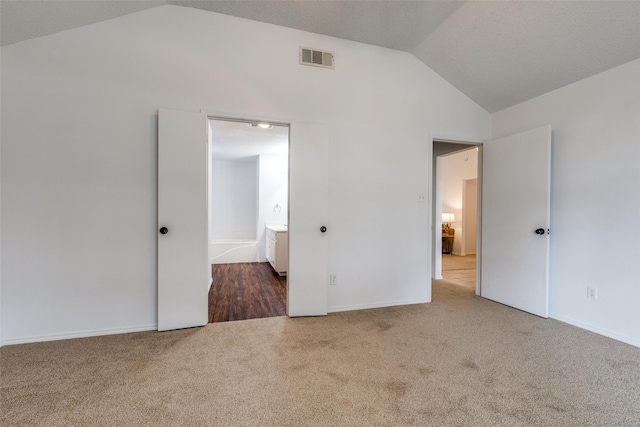 3804 Periwinkle Dr, Fort Worth, TX 76137 - unfurnished bedroom featuring visible vents, baseboards, lofted ceiling, and carpet floors