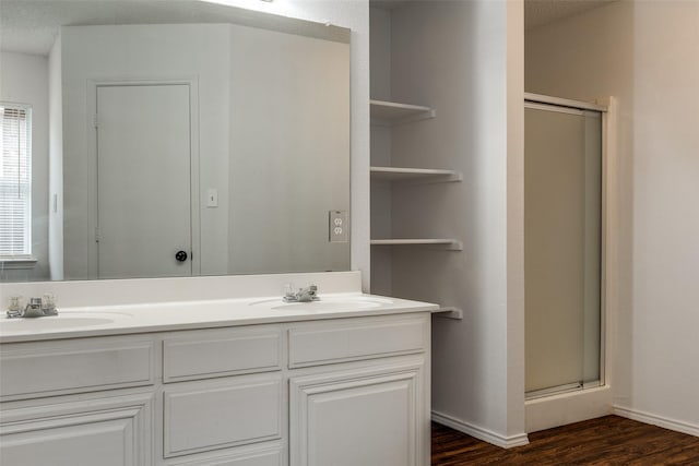 3804 Periwinkle Dr, Fort Worth, TX 76137 - bathroom with wood finished floors, a stall shower, and a sink