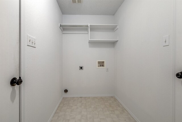 3804 Periwinkle Dr, Fort Worth, TX 76137 - laundry area featuring electric dryer hookup, laundry area, hookup for a washing machine, light floors, and a textured ceiling