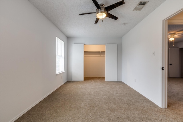 3804 Periwinkle Dr, Fort Worth, TX 76137 - unfurnished bedroom with carpet, a ceiling fan, a textured ceiling, visible vents, and baseboards