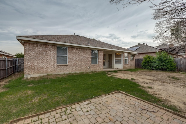 3804 Periwinkle Dr, Fort Worth, TX 76137 - rear view of house featuring a lawn, brick siding, a patio area, and a fenced backyard