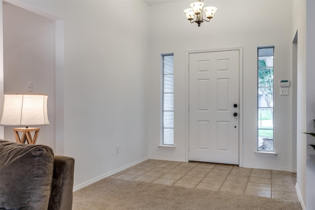 3804 Periwinkle Dr, Fort Worth, TX 76137 - entryway with a wealth of natural light, a chandelier, light tile patterned flooring, and a high ceiling