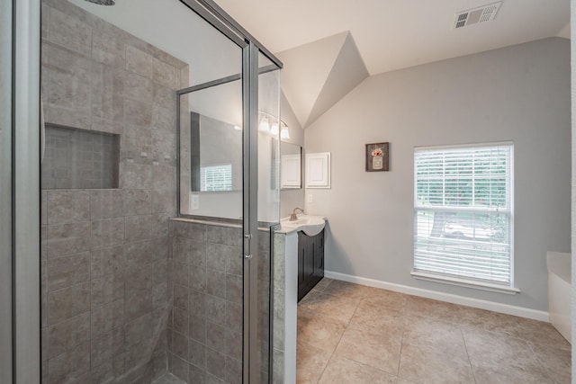 bathroom with visible vents, tile patterned flooring, a shower stall, vanity, and lofted ceiling