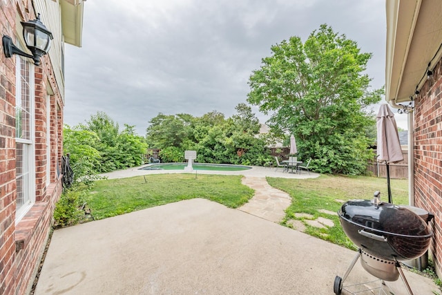 view of patio featuring a fenced backyard and an outdoor pool