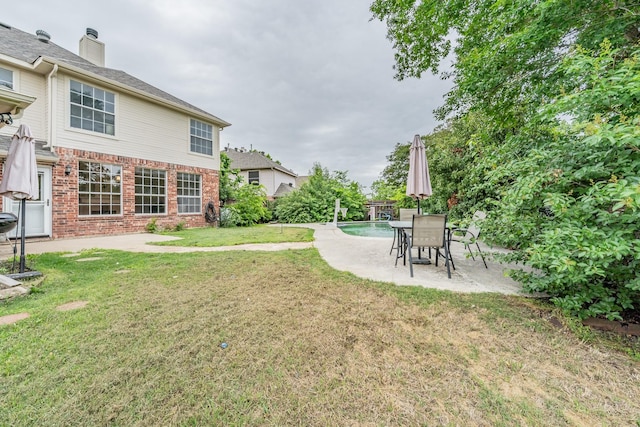 view of yard with a patio area and an outdoor pool