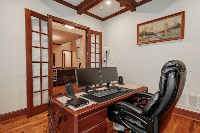 office with french doors, wood finished floors, and visible vents
