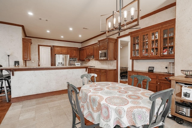 dining space featuring visible vents, ornamental molding, and recessed lighting
