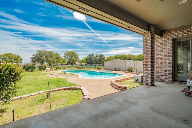 view of pool with a lawn, a patio, a fenced in pool, and a fenced backyard