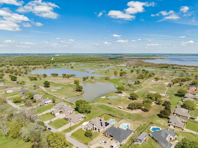 bird's eye view featuring a residential view, view of golf course, and a water view