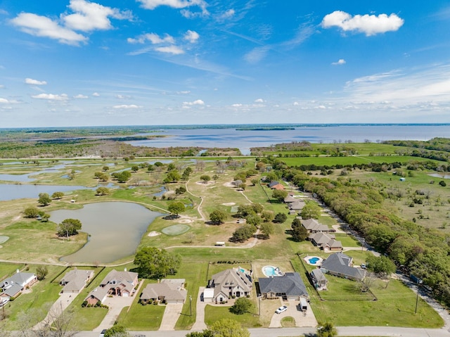birds eye view of property with a water view and a residential view