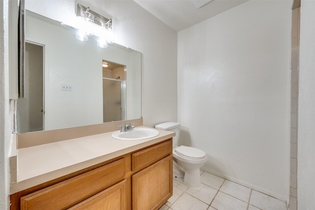 full bathroom featuring a shower stall, tile patterned floors, toilet, and vanity