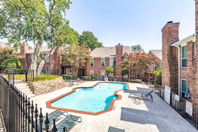 7510 Holly Hill Dr Unit 159, Dallas, TX 75231 - community pool featuring a patio
