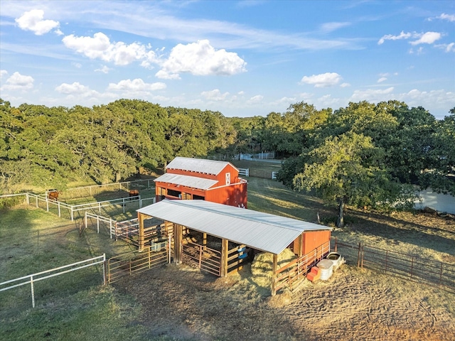 exterior space featuring a rural view and a forest view