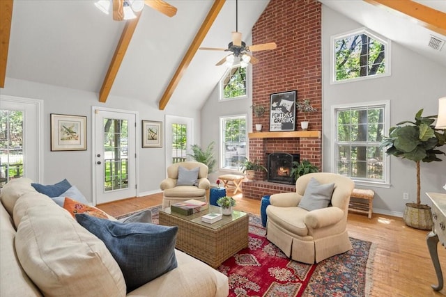 living room featuring baseboards, a ceiling fan, wood finished floors, and high vaulted ceiling