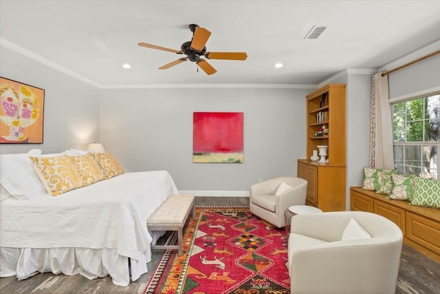 bedroom with crown molding, recessed lighting, wood finished floors, and visible vents