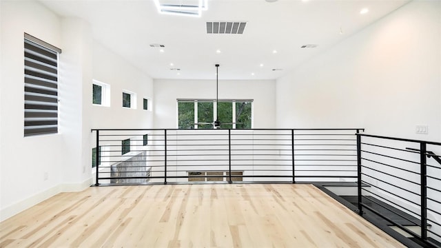 2316 Arroyo Ave, Dallas, TX 75219 - spare room featuring wood finished floors, recessed lighting, and baseboards