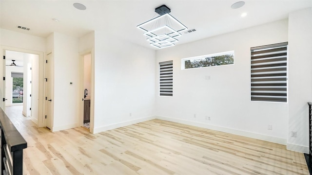 2316 Arroyo Ave, Dallas, TX 75219 - spare room with light wood-style floors, healthy amount of natural light, baseboards, and recessed lighting