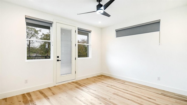 2316 Arroyo Ave, Dallas, TX 75219 - doorway with plenty of natural light, wood finished floors, baseboards, and a ceiling fan